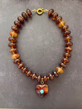 The Wanderheart Necklace: Tortoiseshell beads with a Turquoise centered heart pendant