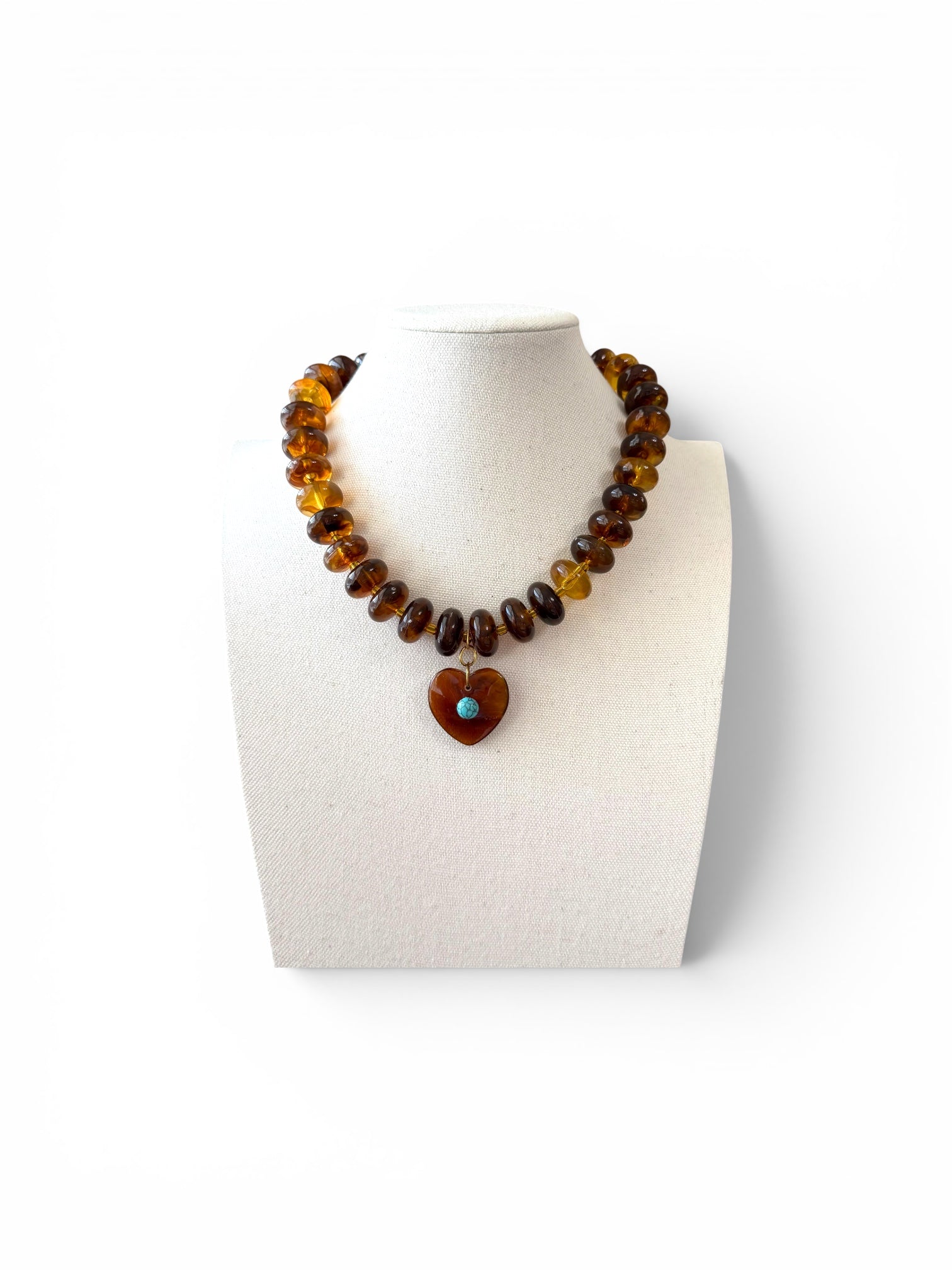 The Wanderheart Necklace: Tortoiseshell beads with a Turquoise centered heart pendant