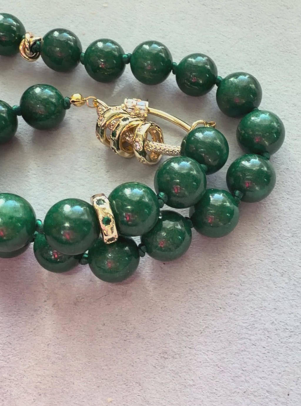 Vintage Vogue Necklace: Vintage Chinese Jade beads hand-knotted on matching satin cord•Gold pavé accents and charms