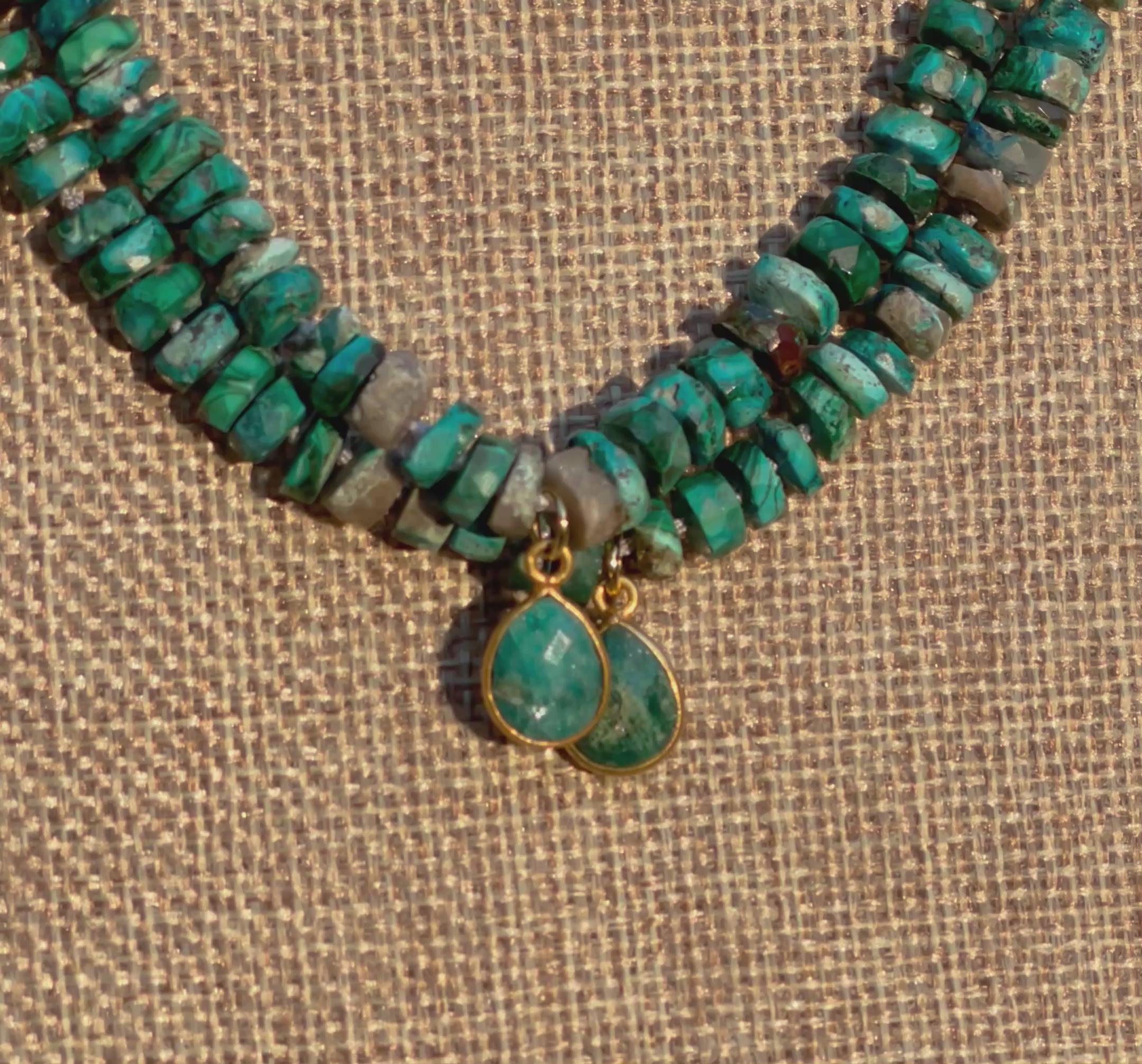 Tibetan Tides Necklace: Faceted Tibetan Turquoise Handknotted on silk with an Emerald teardrop pendant